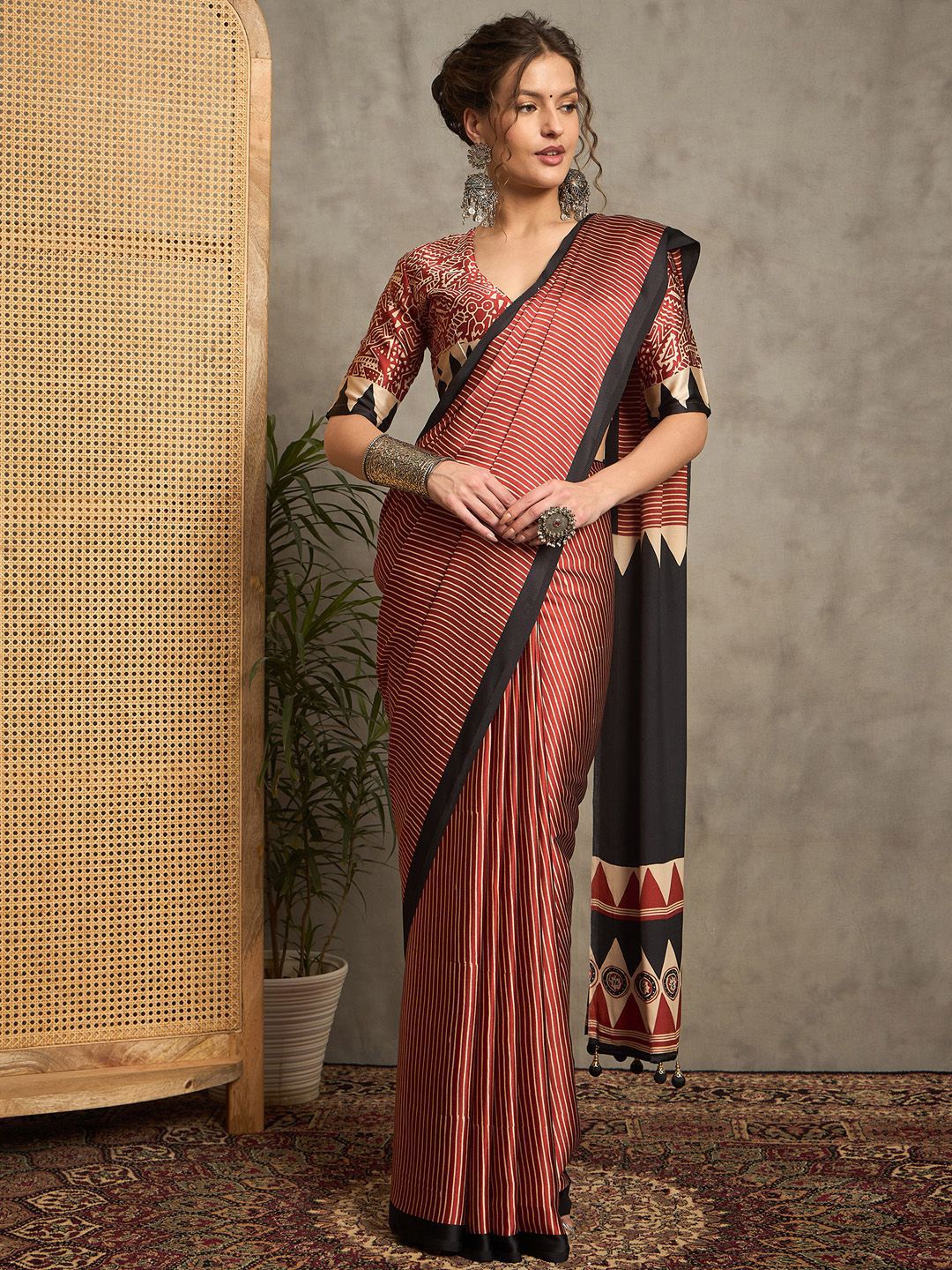 Contemporary Rust & Black Gajji Silk Saree with Tribal-Inspired Border & Printed Blouse